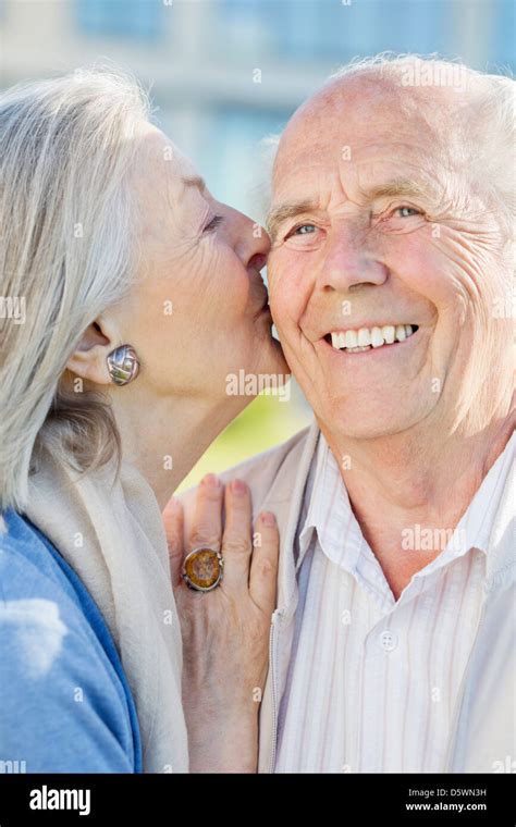 old couple kissing|Older couple kissing hi.